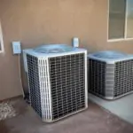 Residential HVAC units that require professional repair or AC service, suggesting a cooling or mechanical failure.